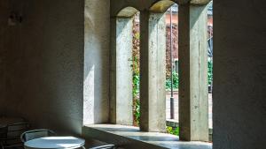 a window in a building with a table and chairs at Kurashiki Ivy Square in Kurashiki +50 photos