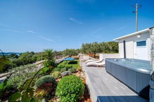 a house with a swimming pool and a garden at Holiday House Roza in Vela Luka
