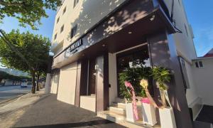 a store front of a building with potted plants outside at Lantana Daegu Shinam Branch in Daegu