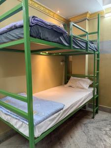 a bedroom with bunk beds in a hostel at The Basecamp Dorm in Siliguri