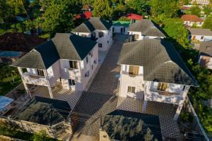 an overhead view of a row of houses at Tanga New Apartments in Tanga