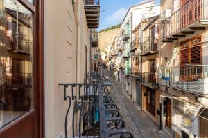 a narrow alley with bikes parked on the side of a building at Identity By Rentbase in Cefalù