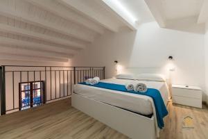a bedroom with a large bed in a room at Identity By Rentbase in Cefalù