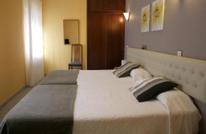 Кровать или кровати в номере Hotel Azpiazu