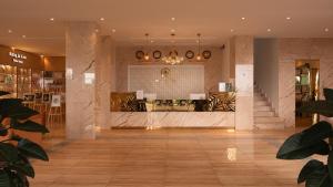 a lobby of a store with a table and chairs at Rung La Kim Resort in Da Lat