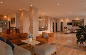 a large living room with couches and a table at Rung La Kim Resort in Da Lat