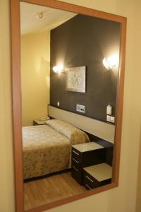 Кровать или кровати в номере Hotel Azpiazu