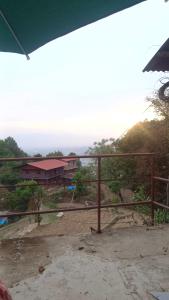 a view of a house with a fence at Nepal VaNaVaS Retreat in Changunarayan