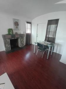 a living room with a table and a fireplace at Unit 1 - Modern Roosevelt Row Condo 2BR 1BA Downtown Stay in Phoenix