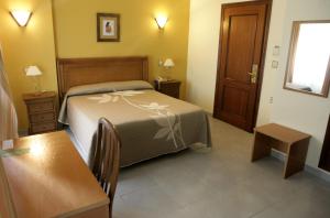 Кровать или кровати в номере Hotel Azpiazu
