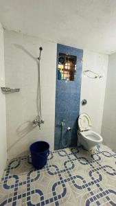 a bathroom with a shower and a toilet in it at Arabian Shore - Udupi in Malpe +27 photos