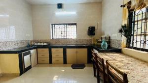 a kitchen with a sink and a counter top at Arabian Shore - Udupi in Malpe