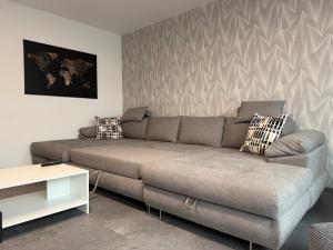 a living room with a couch and a table at Ferienwohnung W&S in Hettstedt