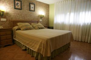 Кровать или кровати в номере Hotel Azpiazu