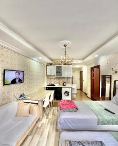 a room with two beds and a table in it at Sultanahmet Lİfe Apart in Istanbul