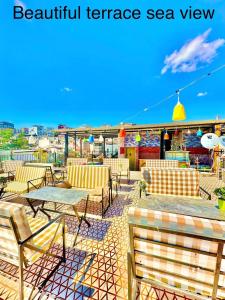 a patio with chairs and tables on a roof at Sultanahmet Lİfe Apart in Istanbul