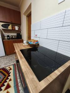 a kitchen with a table with a bowl on it at Casa del Kampos in Kambos +36 photos