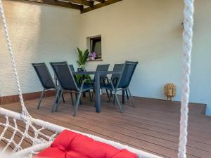 a dining room with a table and chairs at Bled Vista Apartments in Bled