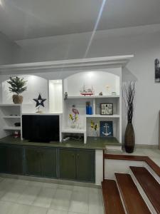 a living room with a television on a counter at C&M Dream House in Morro del Jable