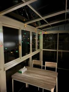 a table and chairs in a room with a window at AX-Asaka House-ST0176 in Asaka