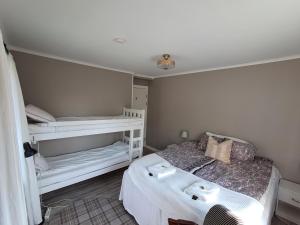 a small bedroom with two bunk beds in it at Ankis i Virserum in Virserum