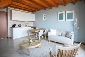a living room with a couch and a table at Lake Iseo View Retreat - Quiet & Nature in Fonteno