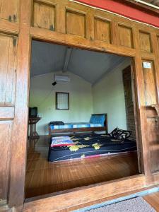 a bedroom with two beds inside of a room at Rumah Ukhi Guest House in Yogyakarta