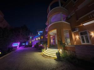 a building at night with stairs in front of it at Tutankhamun Pyramids boutique in Cairo