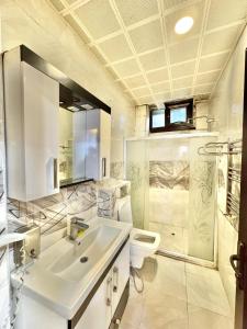 a bathroom with a sink and a toilet at Sultanahmet Lİfe Apart in Istanbul +123 photos