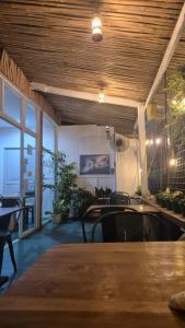a dining room with a table and some plants at Lucy's Diner Hostel Cafe in San Francisco +24 photos