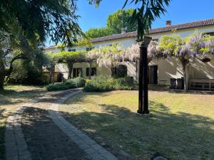 a house with a light pole in the yard at Villa Riviera in Mira