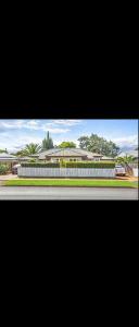 a view of a building with a car on a street at Home in Newtown in Toowoomba
