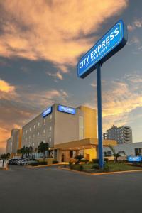 a building with a street sign in front of it at City Express by Marriott Reynosa in Reynosa