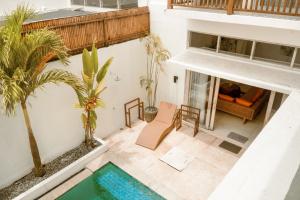 an aerial view of a living room with a swimming pool at Casa Solisa in Kerobokan