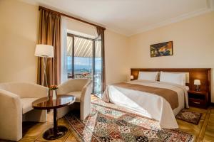 Voodi või voodid majutusasutuse Arève Résidence Boutique Hotel toas