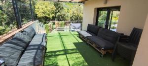 a living room with a couch and a patio at Caribe in Platja d'Aro