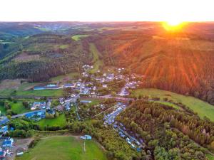 an aerial view of a small town in the mountains at Pod View-side river am clerve in Enscherange