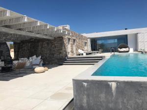a backyard with a swimming pool and a house at Villa Paleopoli in Kythira
