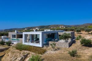 a house on a hill with a swimming pool at Villa Paleopoli in Kythira