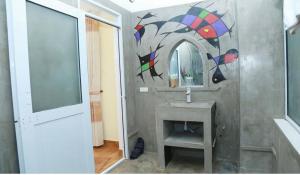 a bathroom with a sink and a mirror at Phong Nha Midtown Hotel in Phong Nha +27 photos