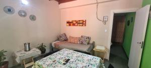 a room with a couch and a table in it at OASIS II Las Moras, con cochera y jardin in La Rioja