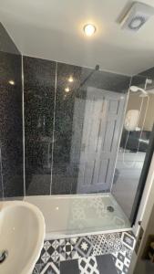 a bathroom with a shower and a sink at Fairwinds in Inverness +1 photo