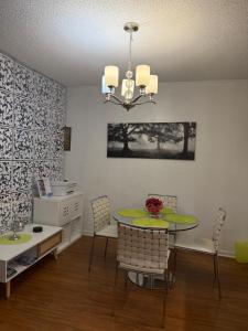 a dining room with a table and chairs at Apartments TVG Miami by the ocean ! in Miami Beach +30 photos