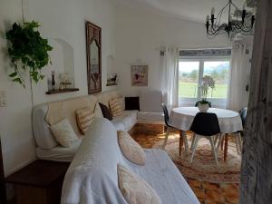 a living room with a couch and a table at Villa la Myreclose in Saint-Auban +34 photos