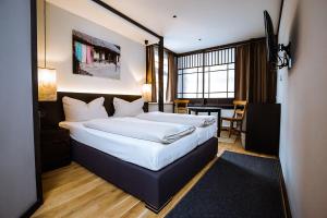 Un pat sau paturi într-o cameră la Hotel zur Amtspforte