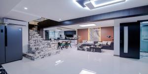 a large living room with a stone wall at 上海NICE民宿 Shanghai NICE B&B ZFC in Shanghai