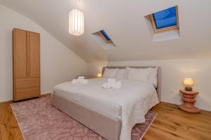 a bedroom with a bed with two candles on it at Vanilla Suite · Kilchberg in Kilchberg