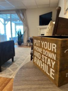 a sign that says put your phone down and stay awhile at Beacon Hudson Hideaway in Beacon +16 photos