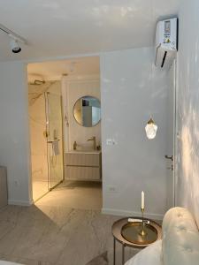 a bathroom with a shower and a sink and a mirror at Sea view in Dubrovnik +54 photos