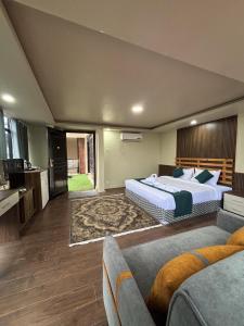 a bedroom with two beds and a living room at Anamnagar Union House in Kathmandu